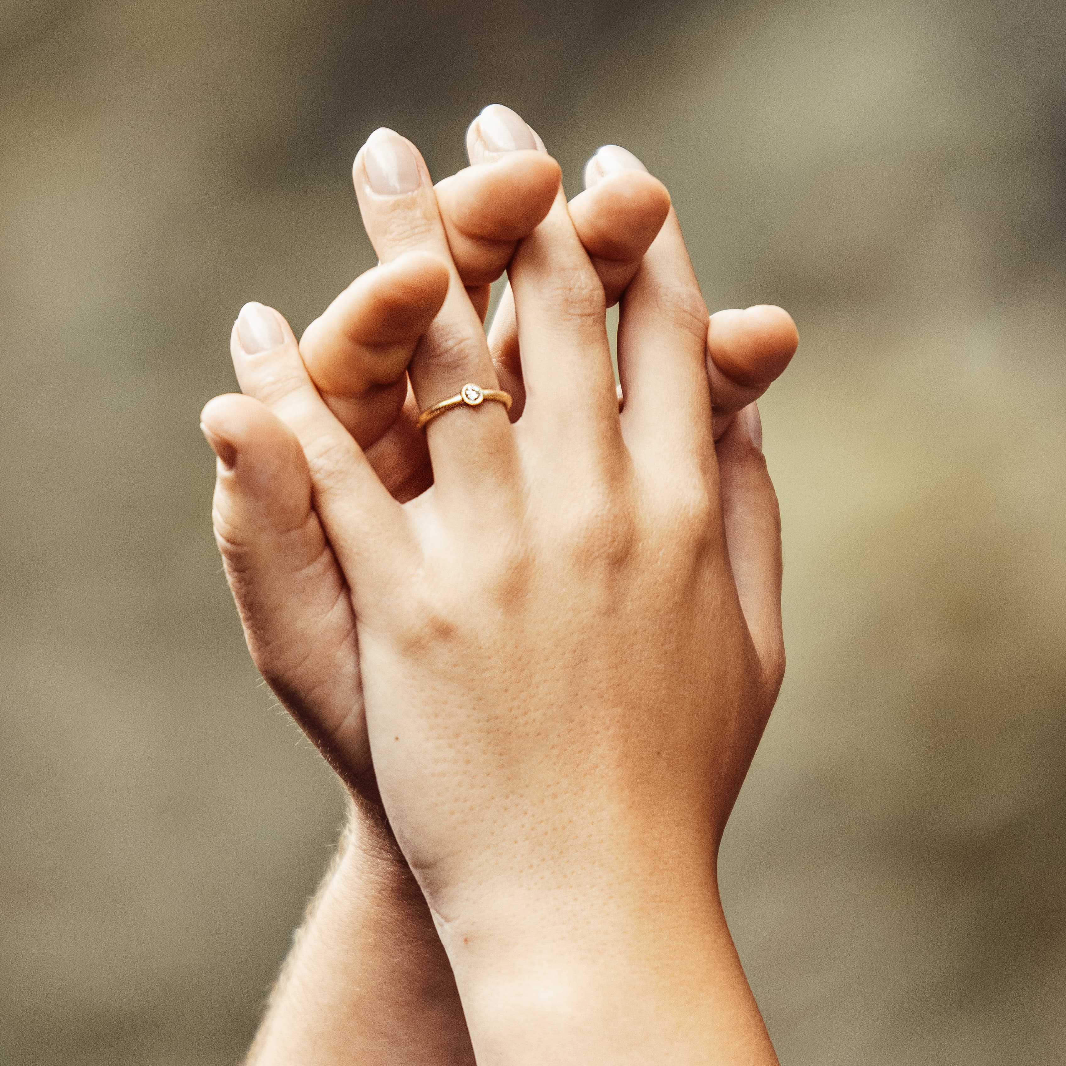 Hands with engagement ring